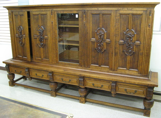 Appraisal: A LARGE FIVE-DOOR OAK BOOKCASE ON STAND Continental mid th