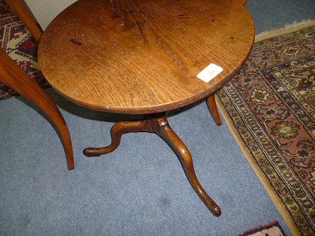 Appraisal: A SMALL POSSIBLY GEORGIAN OAK CIRCULAR LOW TRIPOD TABLE with