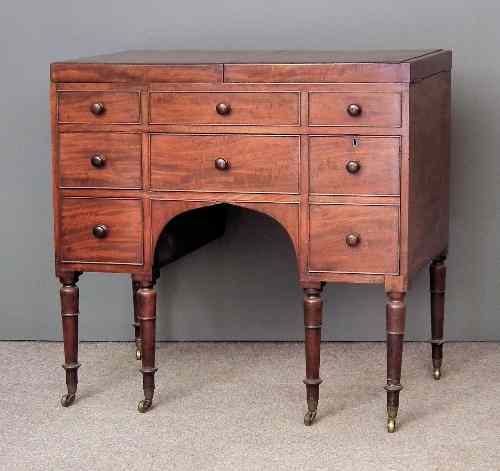 Appraisal: A late George III mahogany enclosed dressing table the folding