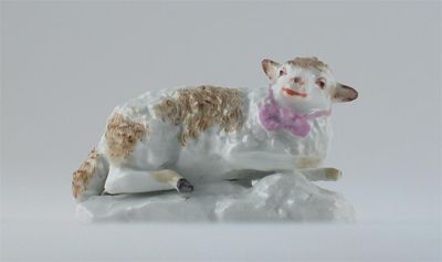 Appraisal: A Meissen lamb lying on a moulded base its head