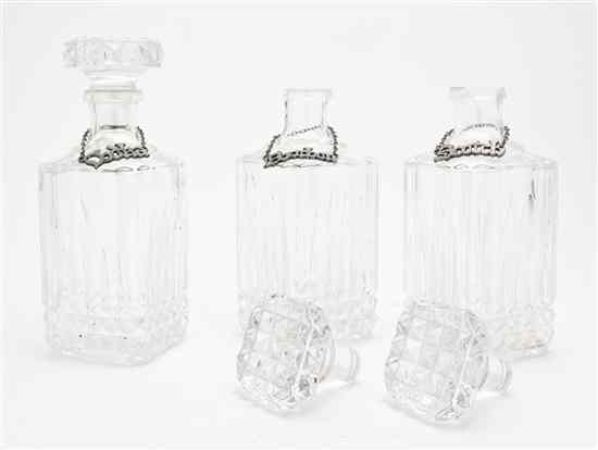 Appraisal: A Set of Three Molded Glass Decanters each having a