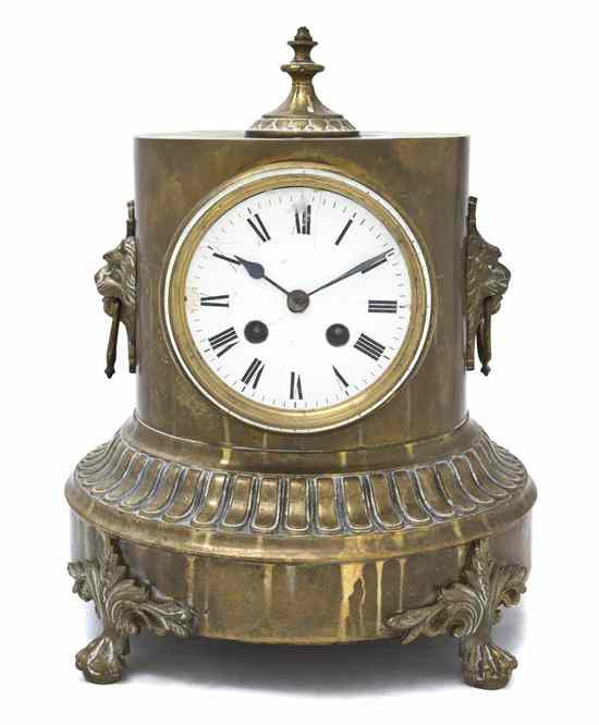 Appraisal: A French Brass Table Clock of columnar form with lion