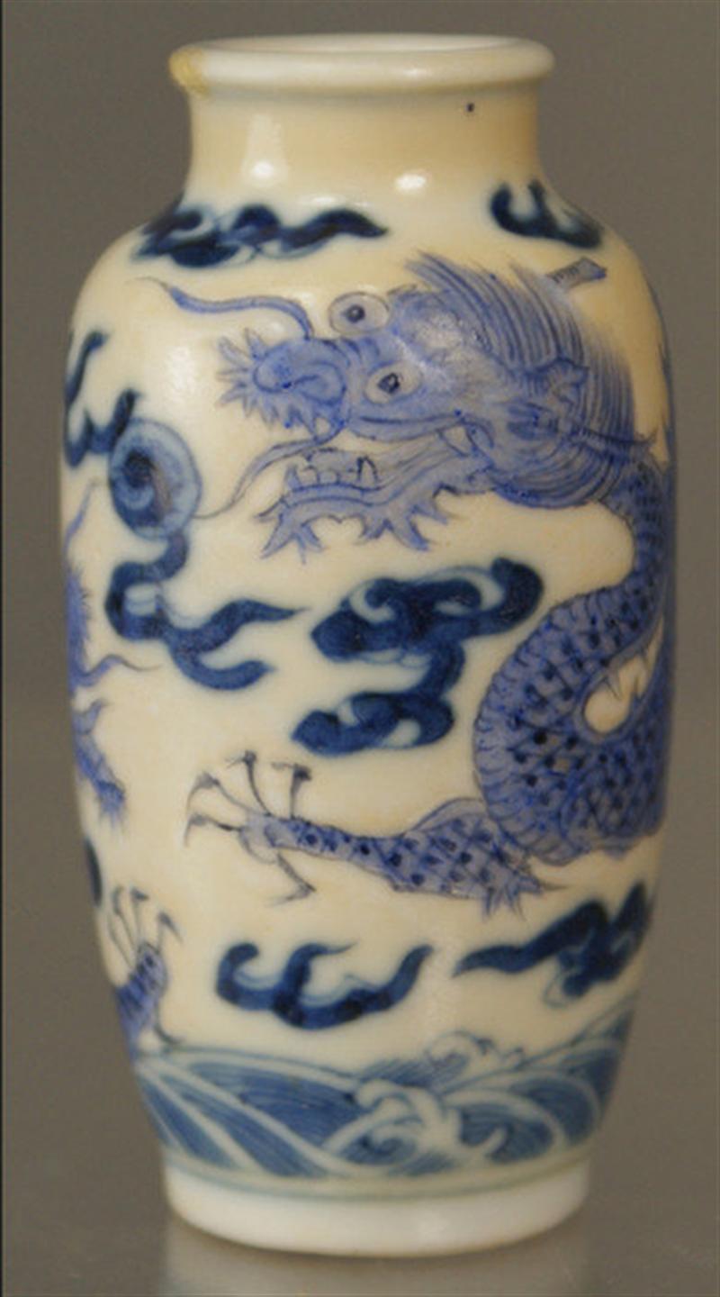 Appraisal: Wide neck porcelain opium bottle blue underglaze raised enamel dragon