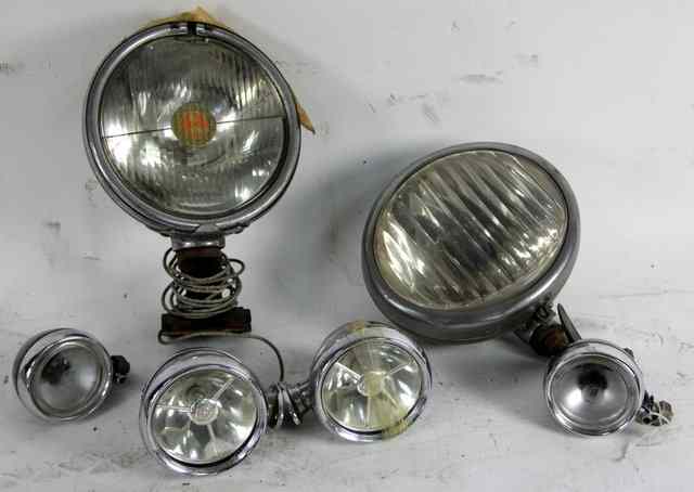 Appraisal: A fogmaster headlamp a trippe speedlight headlamp a pair of