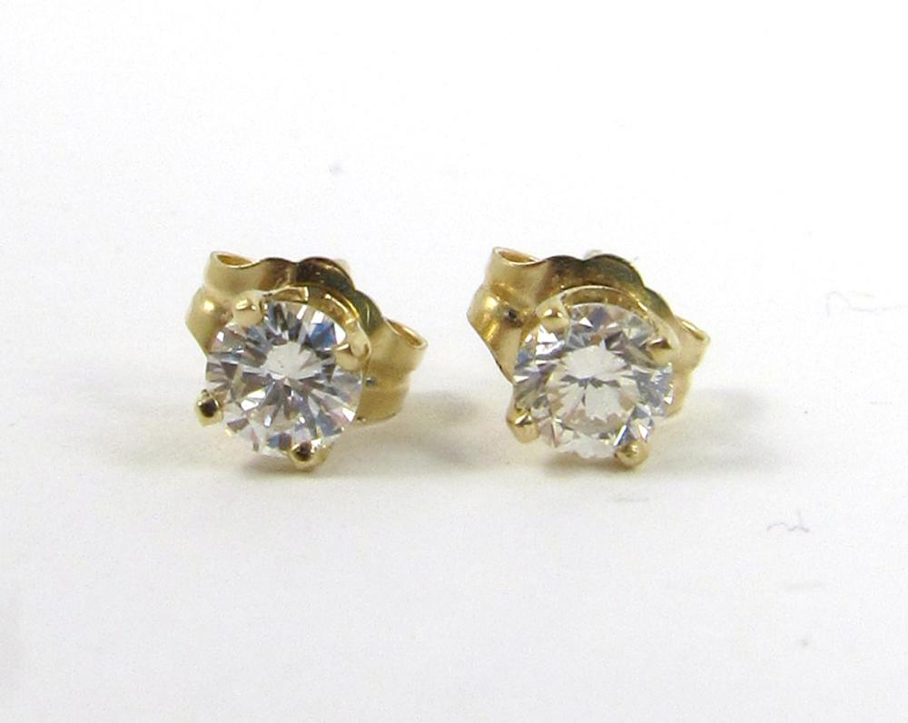 Appraisal: PAIR OF DIAMOND AND FOURTEEN KARAT GOLD EAR STUDS each