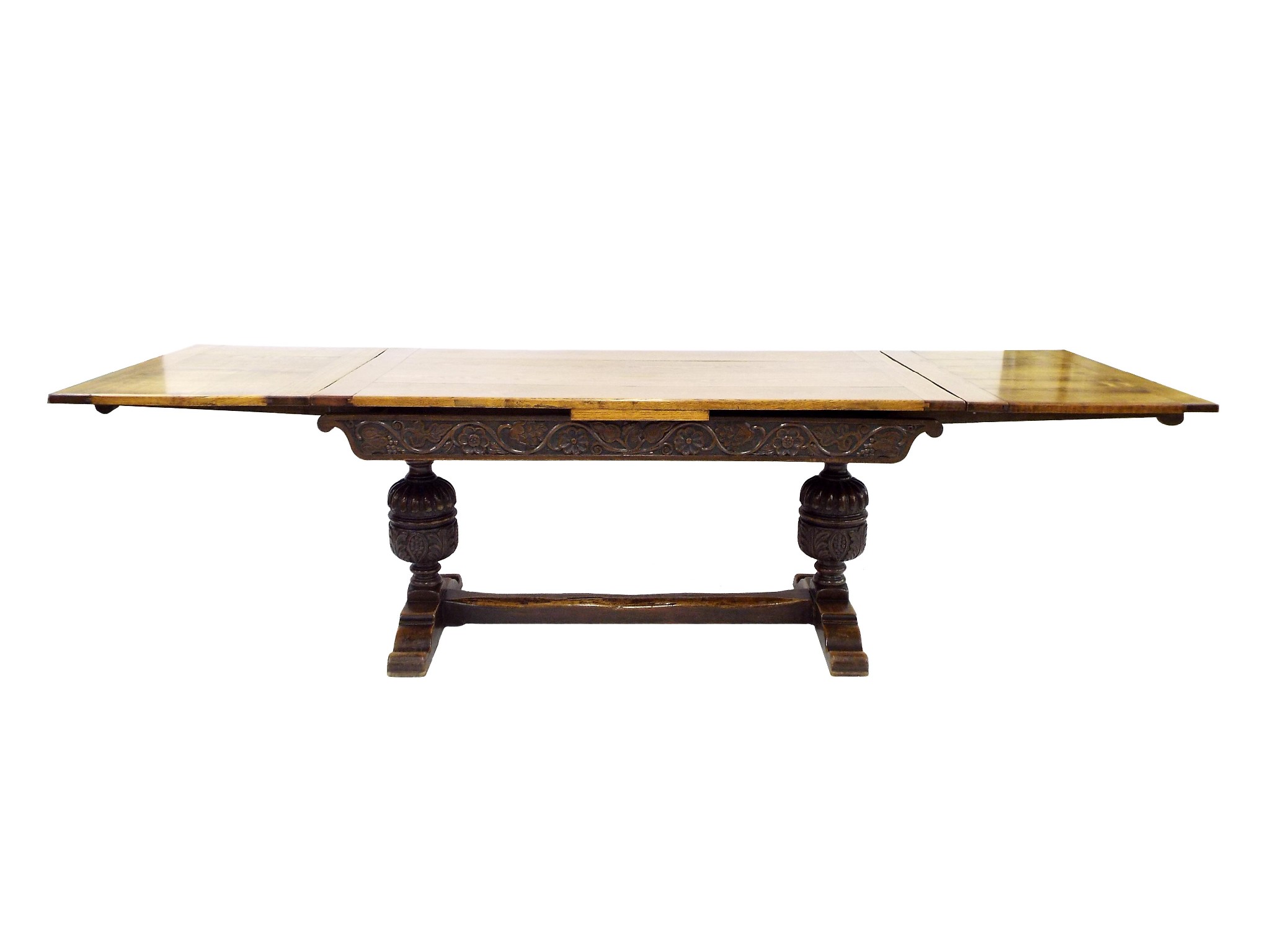 Appraisal: Antique oak draw leaf dining table the base carved with