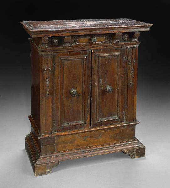 Appraisal: An Italian Baroque walnut cupboard late th early th century