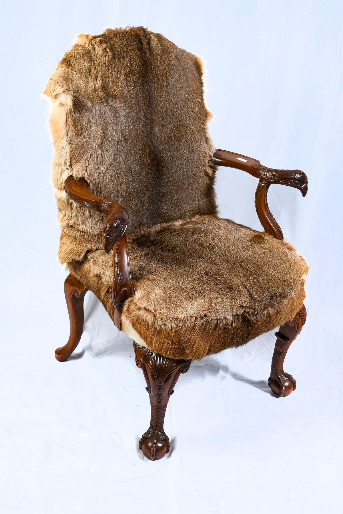 Appraisal: DEER HIDE UPHOLSTERED CHAIR Having Eagle form carved knuckles Raised