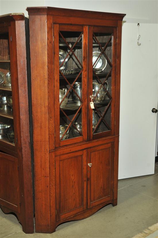 Appraisal: ONE PIECE CORNER CUPBOARD Walnut having a thumb molded cornice