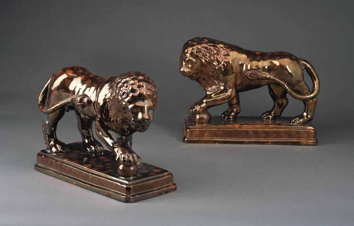 Appraisal: PAIR OF BRITISH SPOTTED COPPER LUSTRE FIGURES OF THE MEDICI