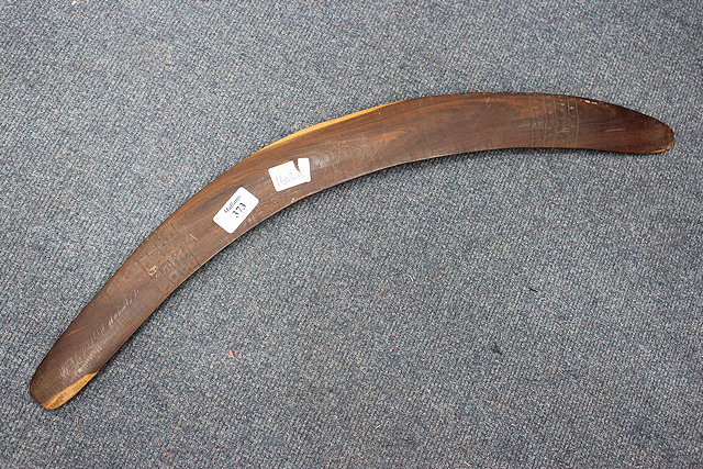 Appraisal: A HARDWOOD BOOMERANG with banded line and dot decoration cm