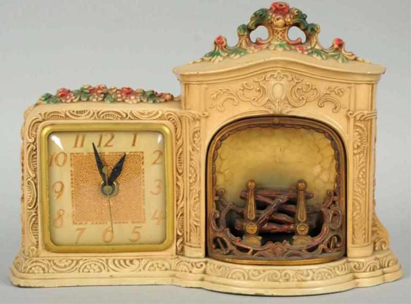 Appraisal: Light-Up Figural Clock Working Depicts a fireplace with simulated fire