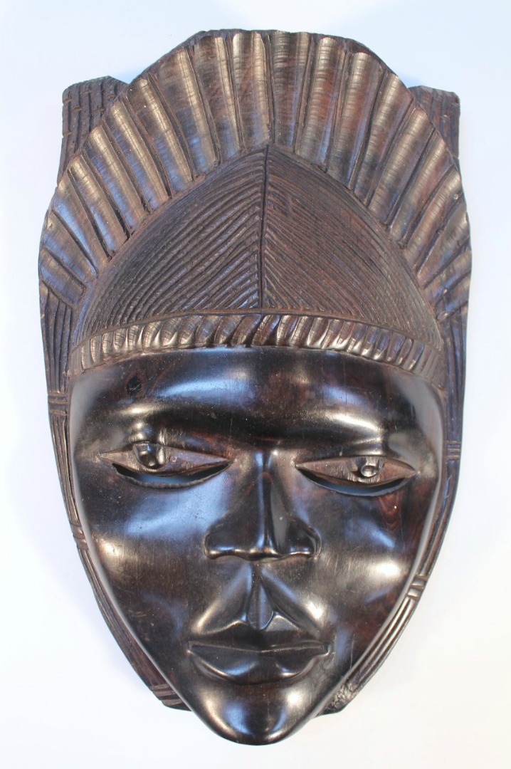 Appraisal: A thC African tribal hardwood face mask carved as a