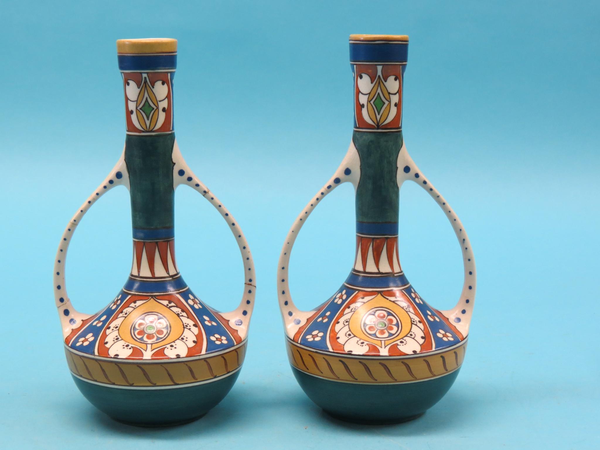 Appraisal: A pair of ancient-style two-handled vases inscribed Lindus Arnhem in