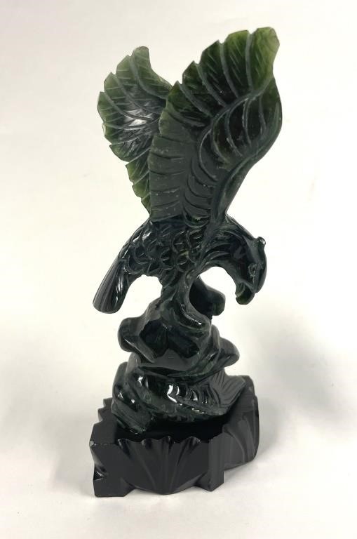 Appraisal: Green hard stone carved sculpture of an eagle with fish