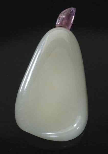 Appraisal: Chinese Qing carved pebble jade snuff bottlewith a tourmaline stopper