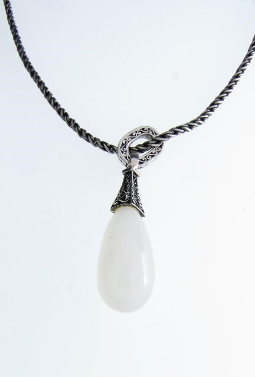 Appraisal: A sterling silver pendant featuring a cabochon teardrop semi-transparent lustrous