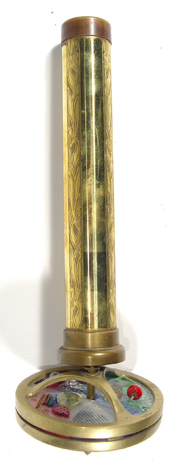 Appraisal: Brass kaleidiscope with coloured glass panels the barrel with chased