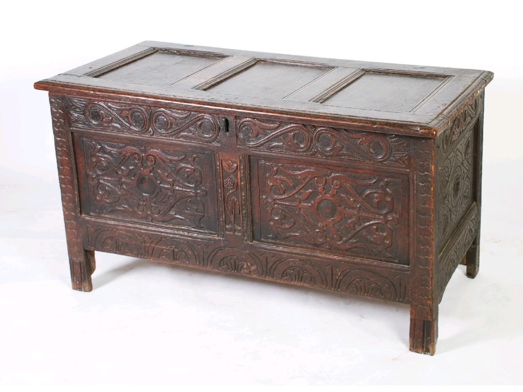 Appraisal: EARLY EIGHTEENTH CENTURY CARVED OAK COFFER the three panel hinged