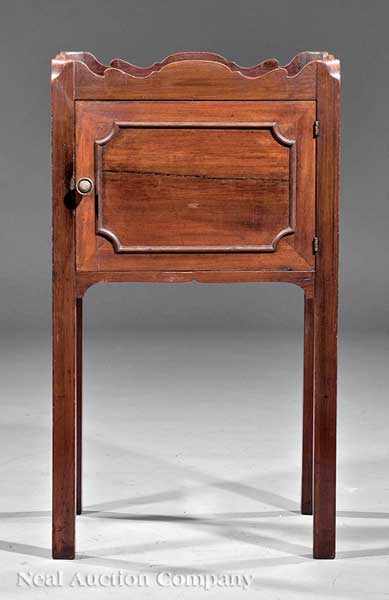 Appraisal: A Georgian-Style Carved Mahogany Bedside Commode shaped gallery single door