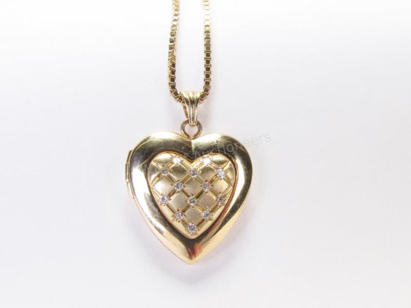 Appraisal: A K yellow gold cushion brushed finish heart locket with