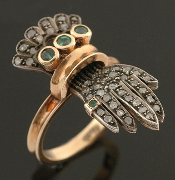 Appraisal: A diamond and emerald ring by Antonio Conte The hand