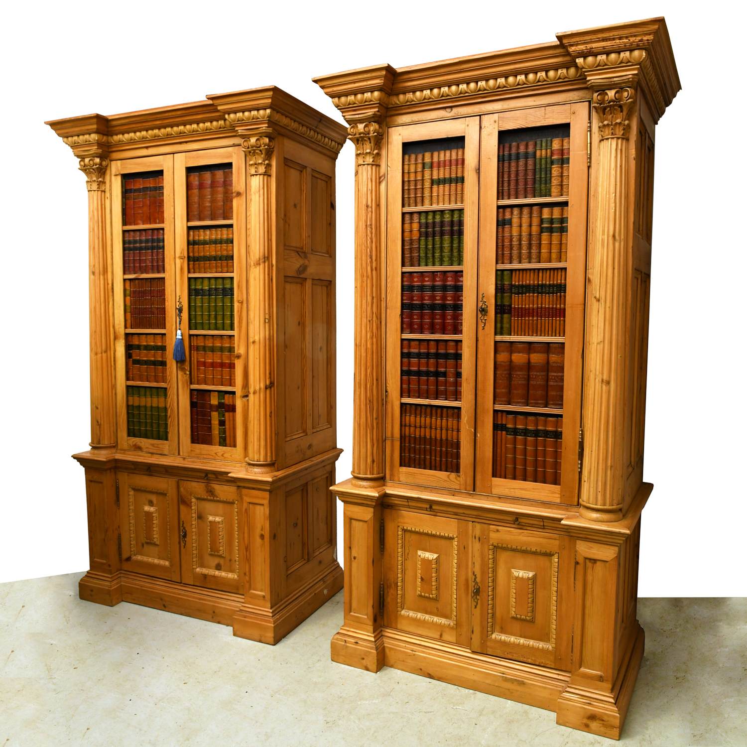 Appraisal: PAIR LARGE ENGLISH PINE FAUX-BOOK CABINETS th c and adapted