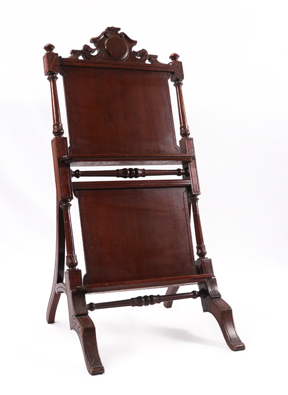 Appraisal: VICTORIAN CARVED MAHOGANY EASEL Carved and shaped crest carved and