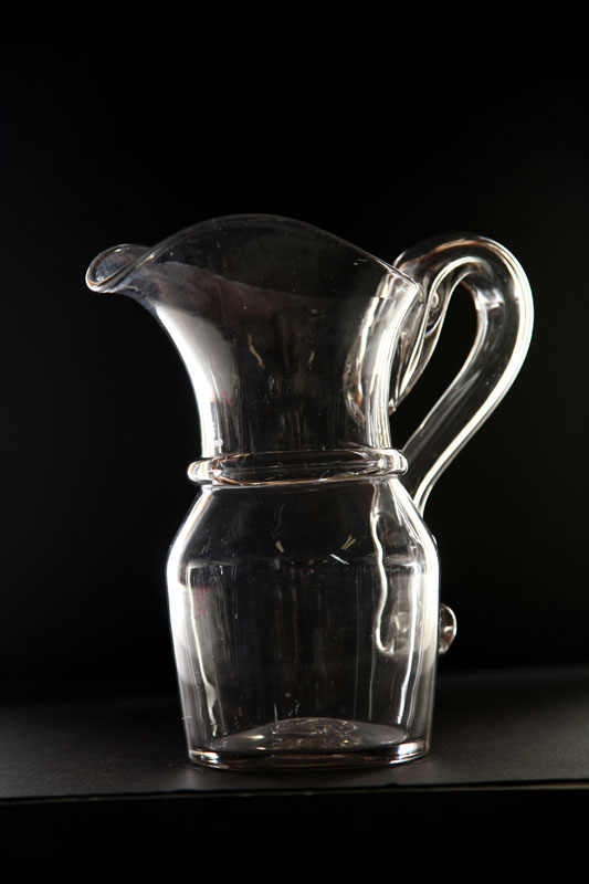 Appraisal: BLOWN GLASS PITCHER Pittsburgh th century Clear glass with applied