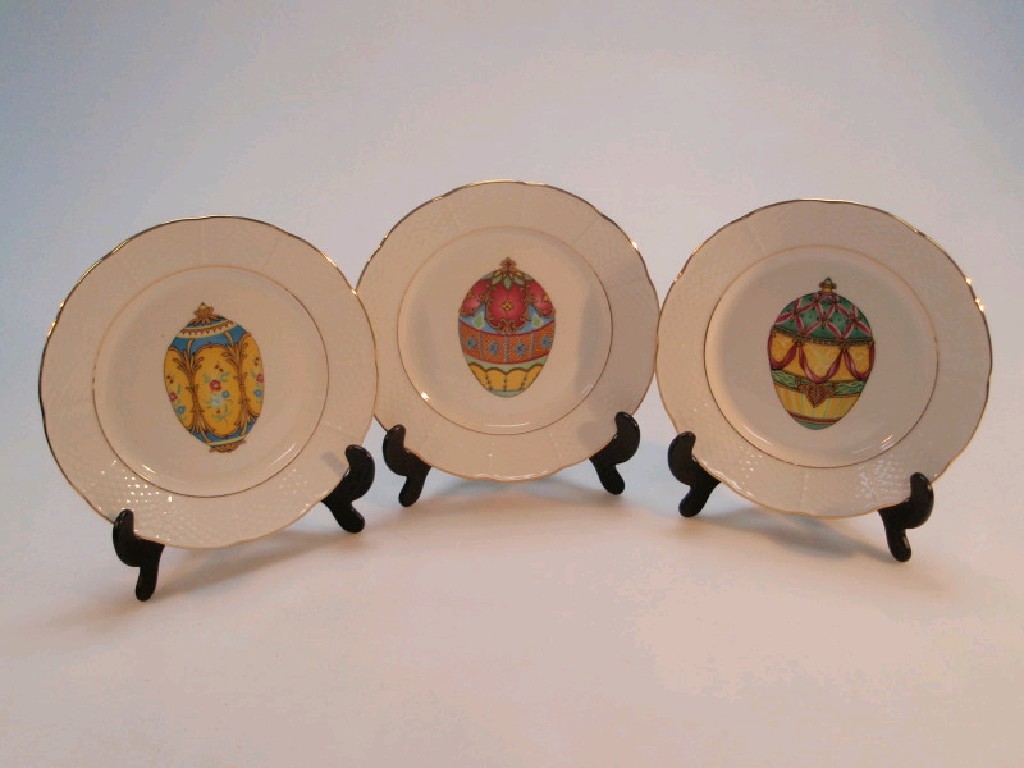 Appraisal: A set of three Limoges plates decorated with Faberge style