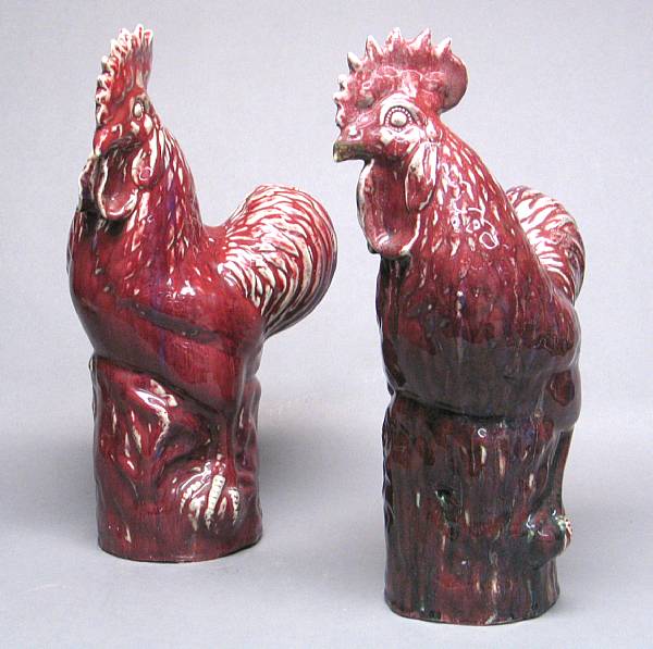 Appraisal: A pair of red flamb glazed porcelain roosters The facing