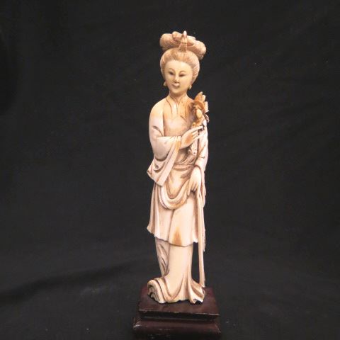 Appraisal: Chinese Carved Ivory Figurine of a Lady flowers in hand