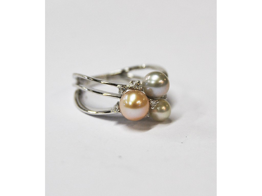 Appraisal: Three pearl ring set white grey and pink coloured cultured