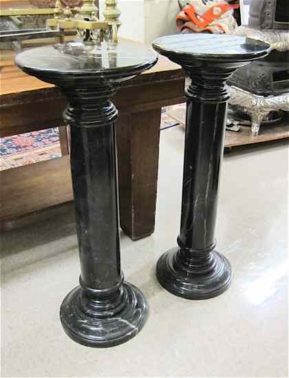 Appraisal: A PAIR OF BLACK ITALIAN MARQUINA MARBLE PEDESTALS both of