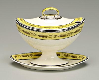 Appraisal: Creamware sauce tureen almond shaped tureen with conforming attached under