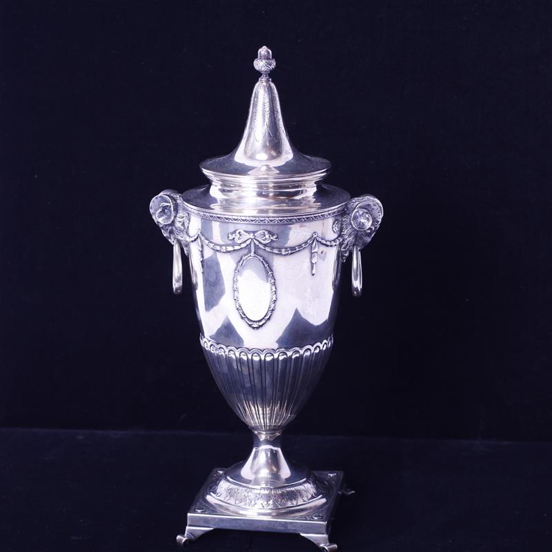 Appraisal: American sterling silver lidded urn with ram head handles Lady