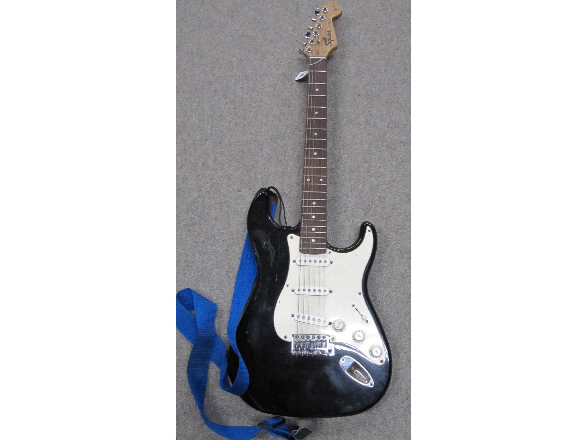 Appraisal: A Squier electric guitar with amplifier