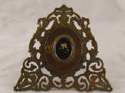 Appraisal: A Brass locket on a pierced frame the locket with