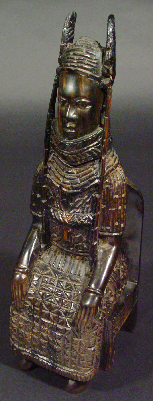 Appraisal: African Benin hardwood tribal carving of an oba seated on