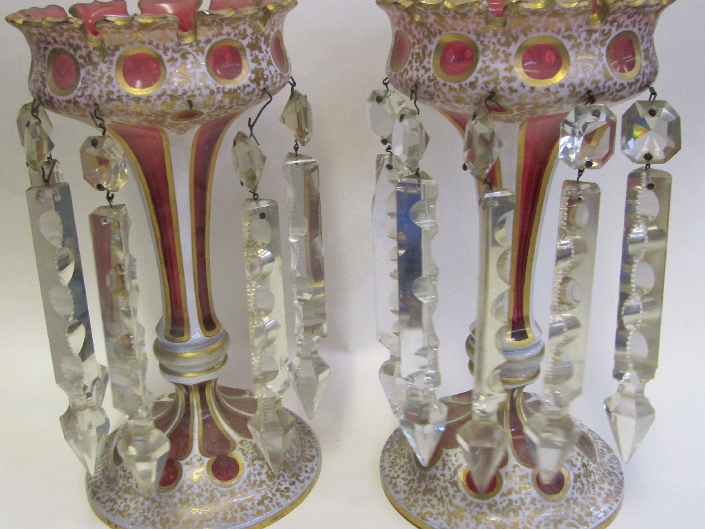 Appraisal: Pair of Bohemian cranberry and overlaid white glass lustres with