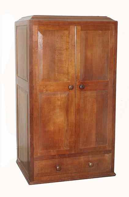 Appraisal: A Gordon Russell 'Stow' oak wardrobe designed by Gordon Russell