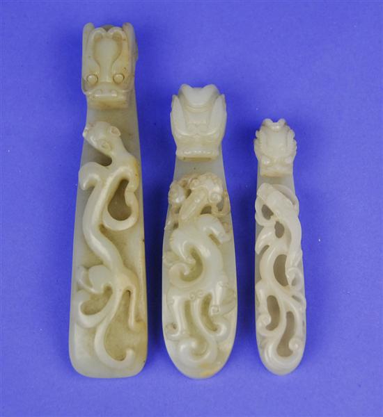 Appraisal: THREE CHINESE CARVED JADE BELT BUCKLES th century length of