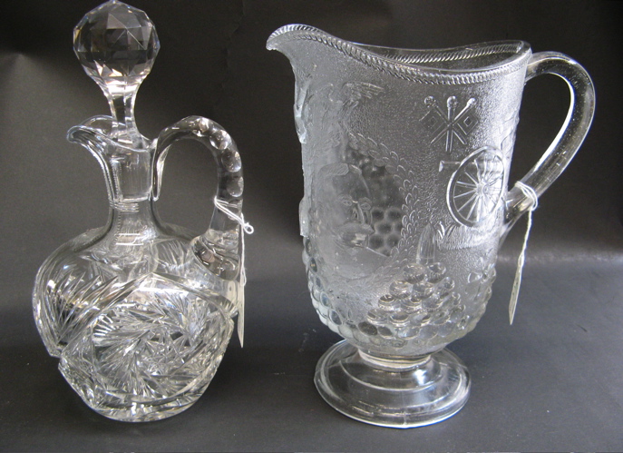 Appraisal: TWO GLASS DRINKS ACCESSORIES One is a handled decanter hobstar