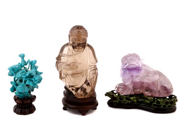 Appraisal: A group of hardstone decoration comprising a tea crystal figure