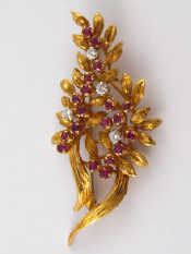 Appraisal: A yellow metal tests ct gold ruby and diamond floral