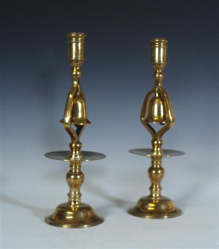 Appraisal: A pair of early th century brass candlesticks with bells