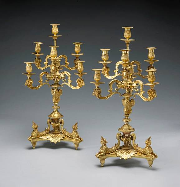 Appraisal: A pair of R gence style gilt bronze seven light