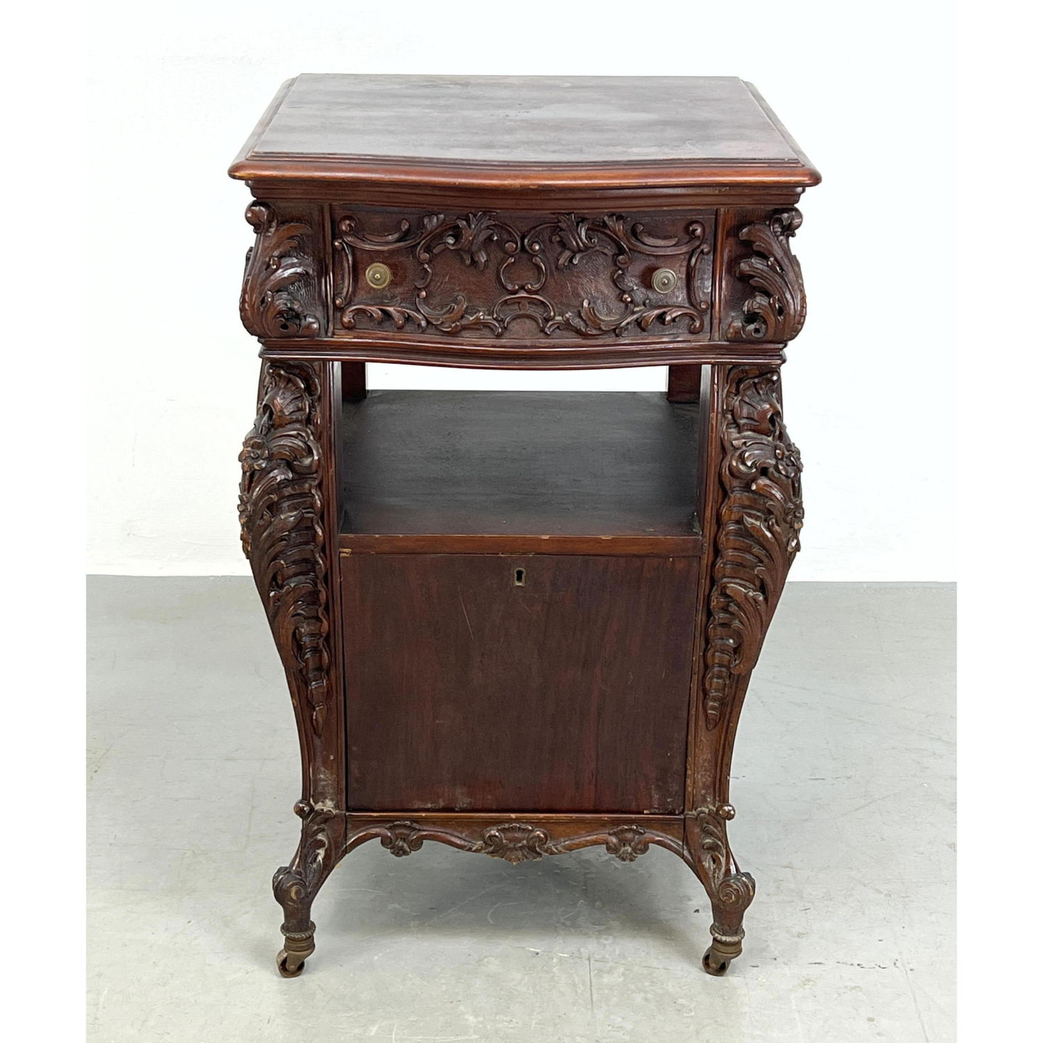 Appraisal: Highly Carved Mahogany Night stand Dimensions H inches W inches