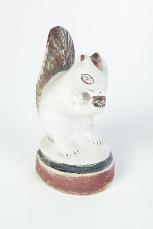 Appraisal: CHALKWARE SQUIRREL American late th century Seated squirrel eating a