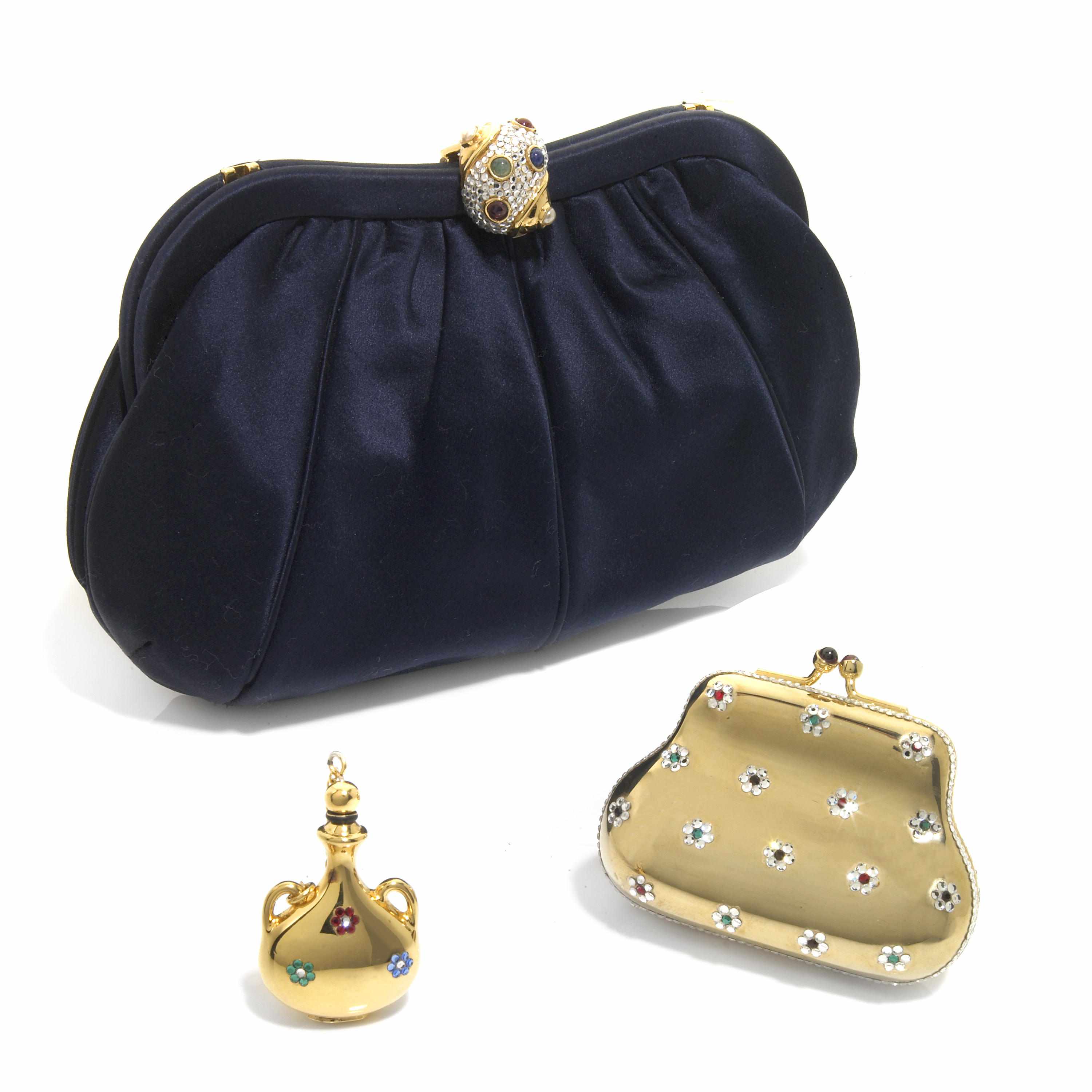 Appraisal: A dark blue satin purse with a silver crystal and